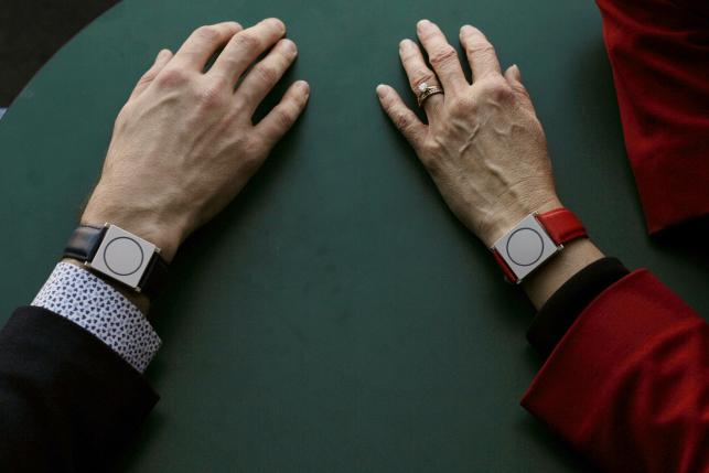 Rosalind Picard, MIT professor and chief scientist at Empatica, and Matteo Lai (L), CEO of Empatica, wear the company's Embrace devices while talking at the Massachusetts Institute of Technology in Cambridge, Massachusetts November 25, 2015.    REUTERS/Brian Snyder